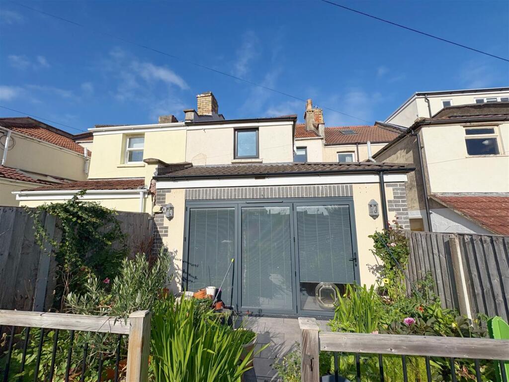 Rear view of property and patio (1).jpg