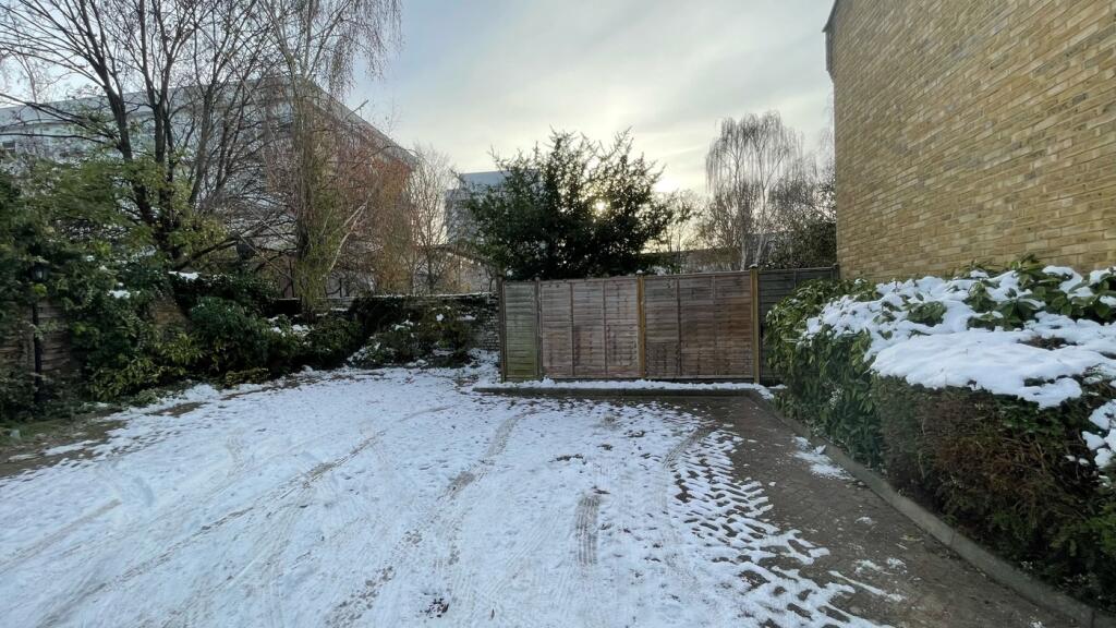 A spacious garden area, beautifully set against...