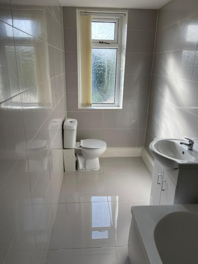 A clean and well-maintained bathroom featuring ...