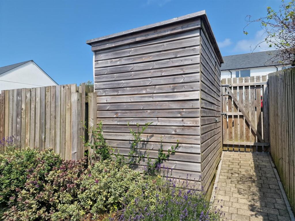 Parking path and shed.