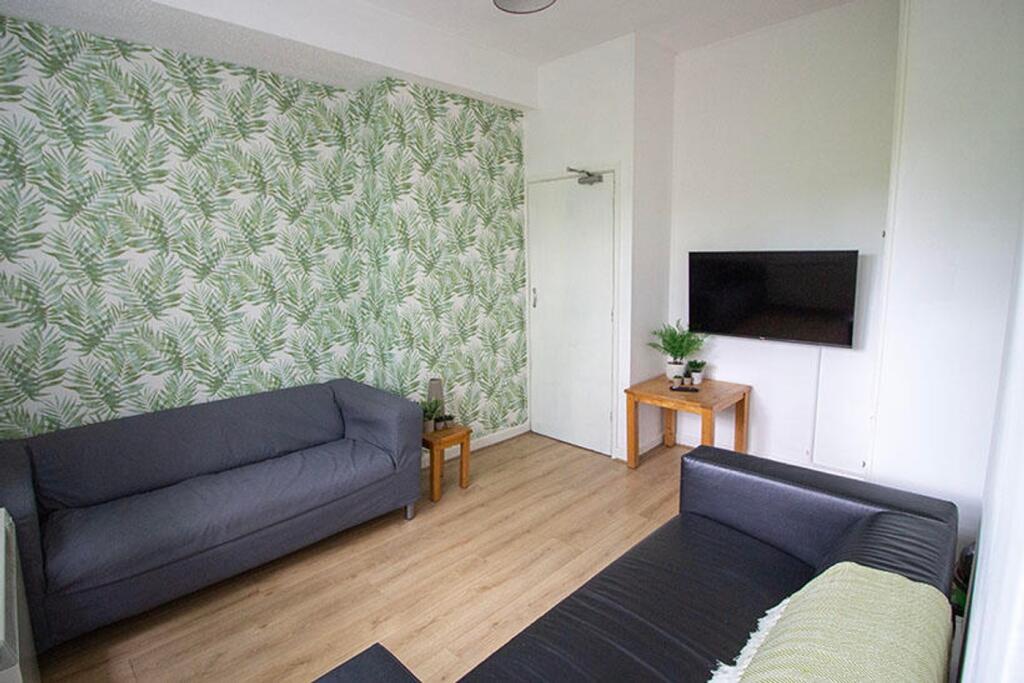 A cozy living room featuring modern decor with ...