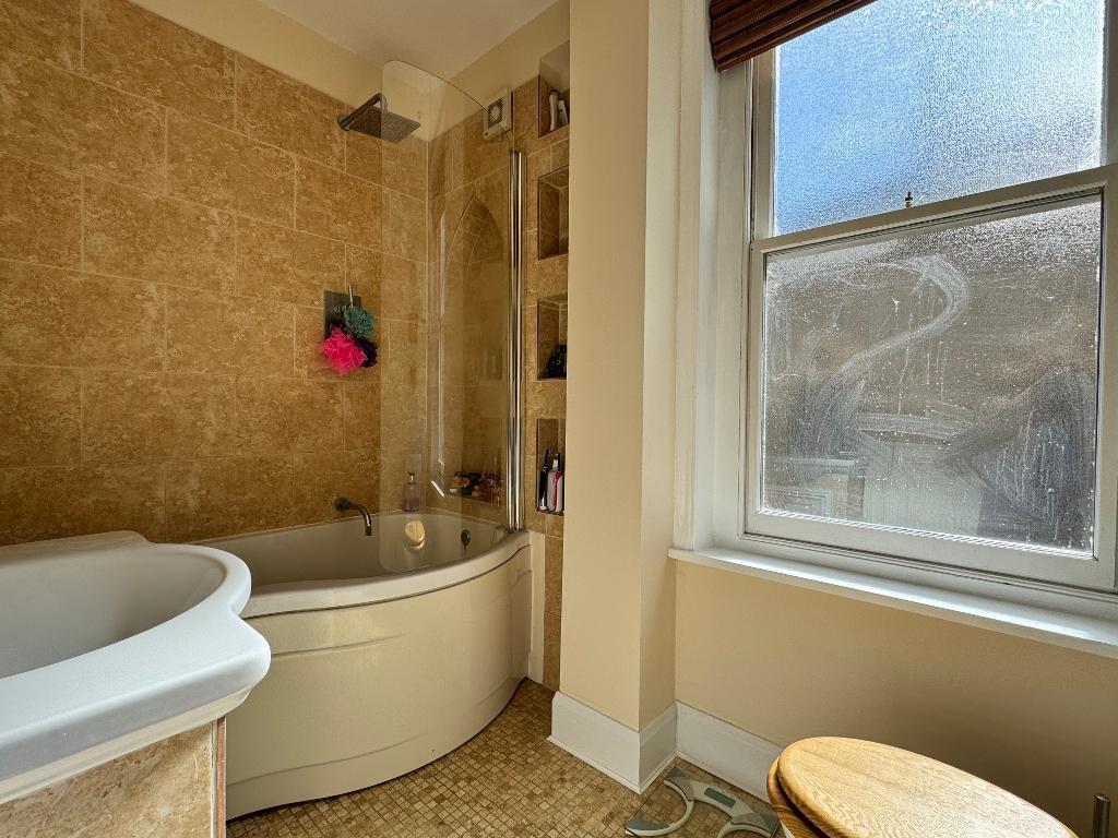 Bathroom with frosted sash window