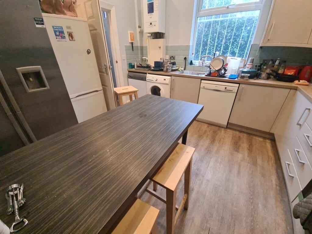 A modern kitchen featuring ample counter space,...