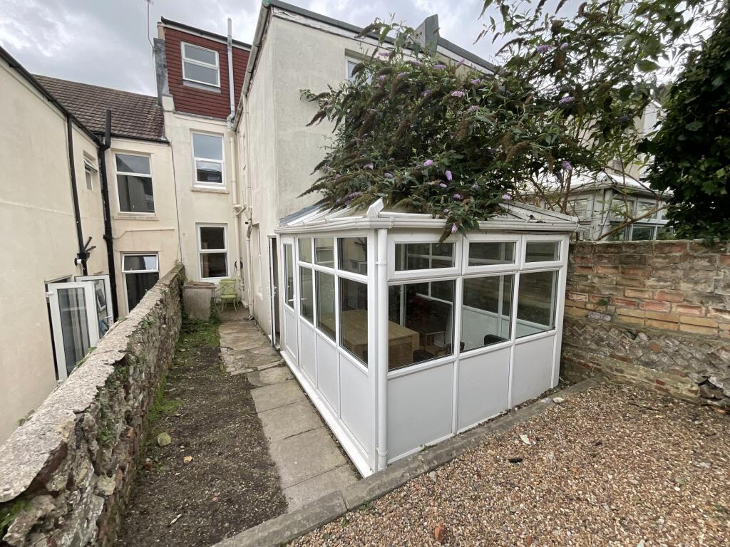 View of the front of a terraced house featuring...