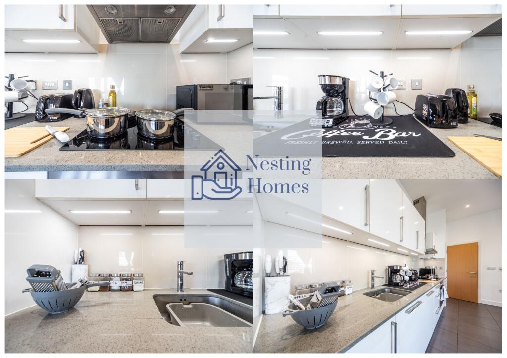 A modern, sleek kitchen featuring a polished gr...