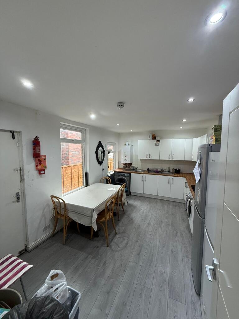 A bright and functional kitchen featuring a lar...
