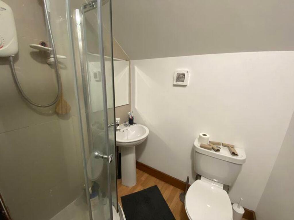 A tidy and functional bathroom featuring a mode...