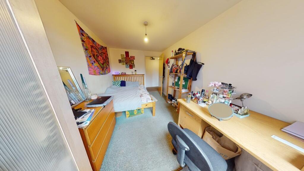 A neat and functional single toilet room with c...