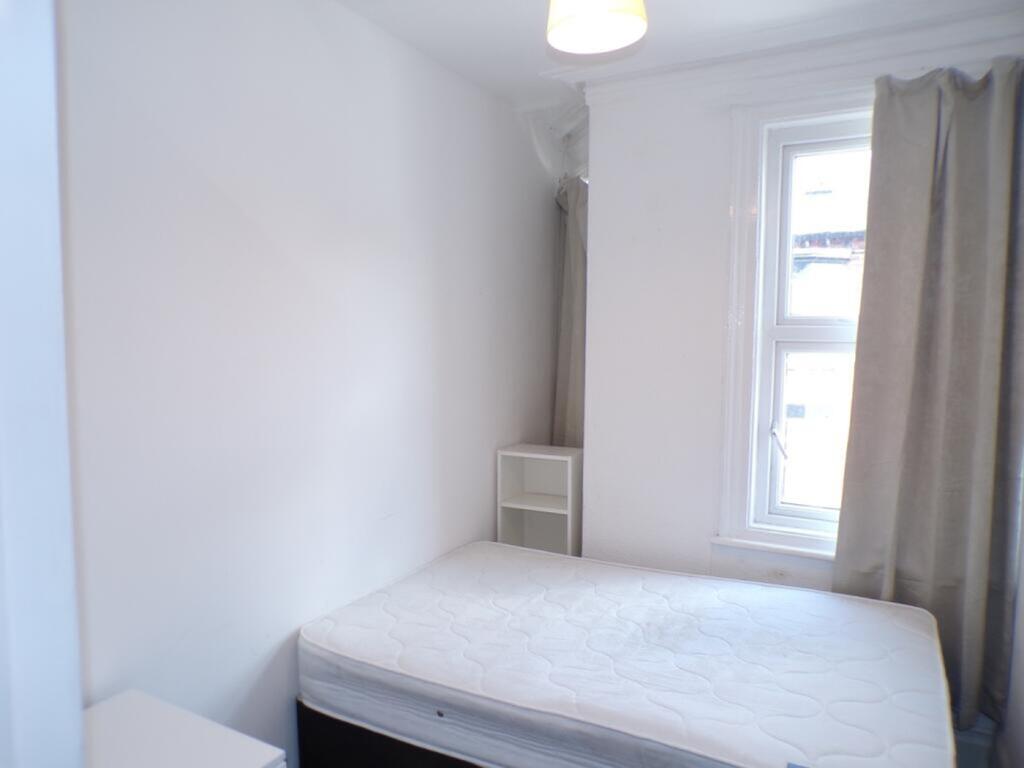 This inviting double bedroom features a bright ...