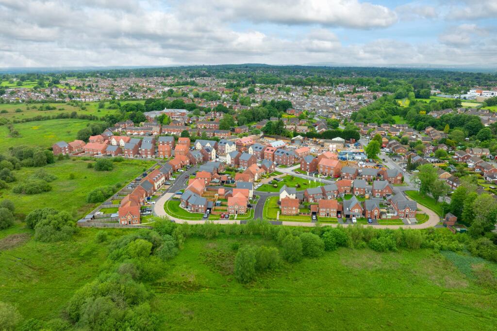 drone view overlooking Silk Waters Green development in Macclesfield