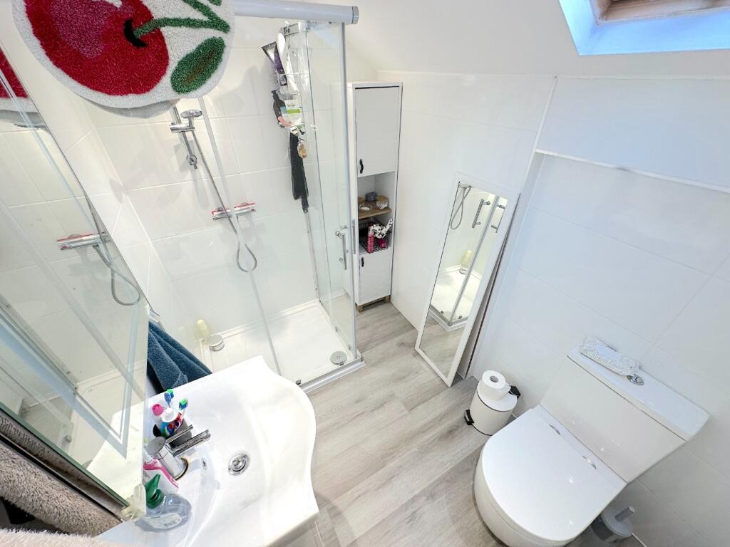 Bright, modern bathroom with a walk-in shower, ...