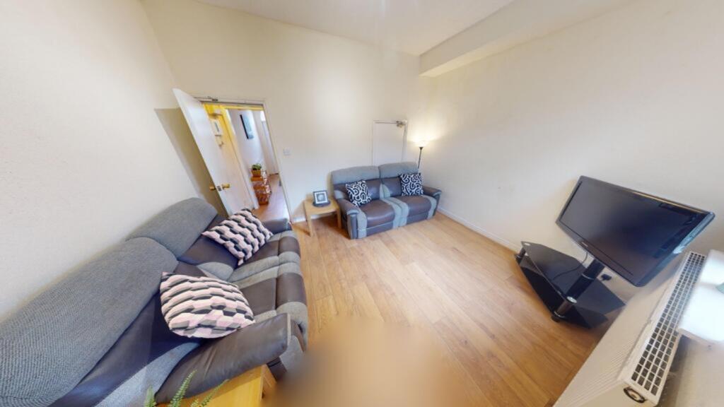 A spacious and inviting large modern living roo...