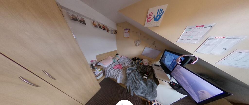A bright and welcoming bedroom with ample natur...