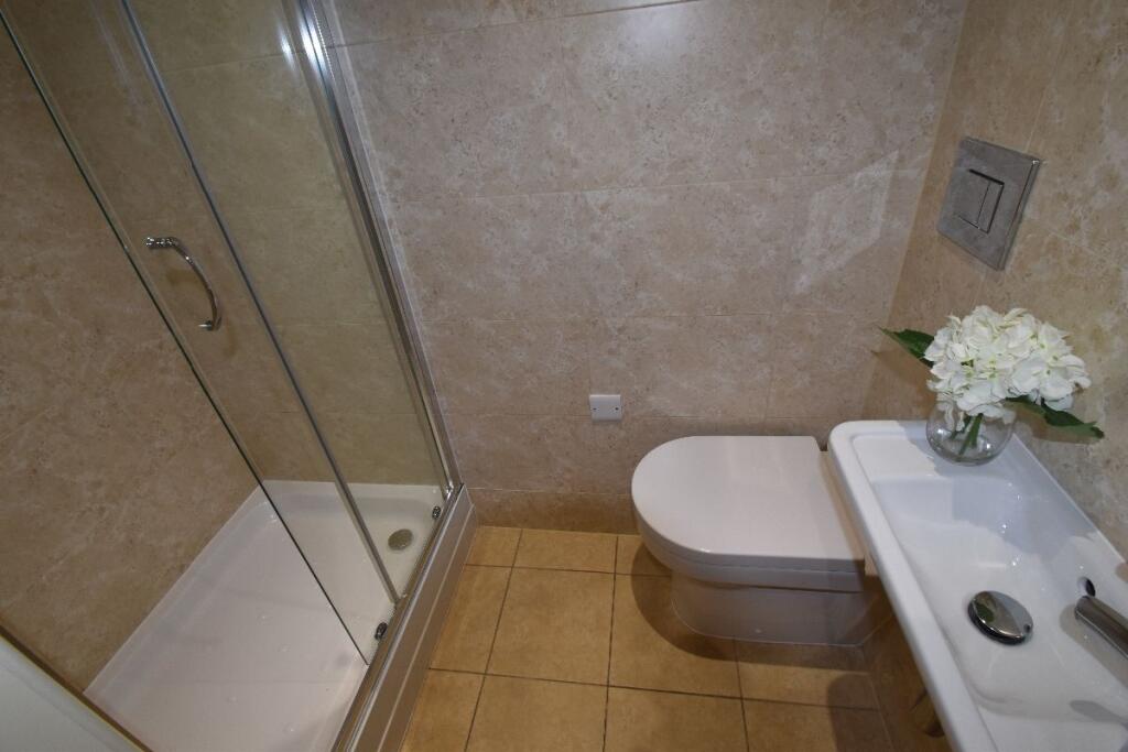 A modern, well-maintained bathroom featuring a ...