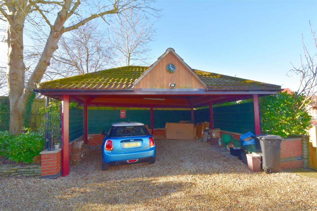 Covered parking to front.jpg