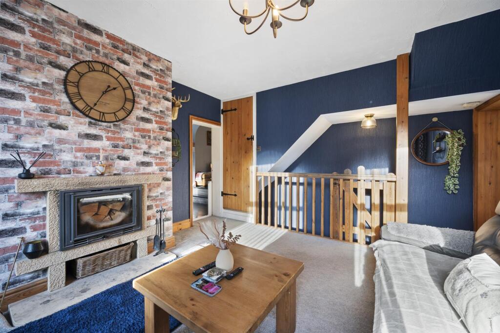 Sitting Room - fireplace and stairs.jpg