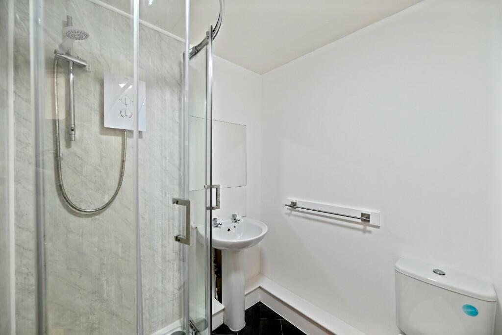 Bright and clean bathroom featuring a modern co...