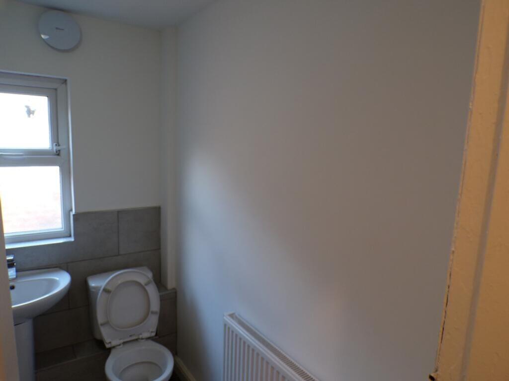 This well-maintained single toilet features a m...