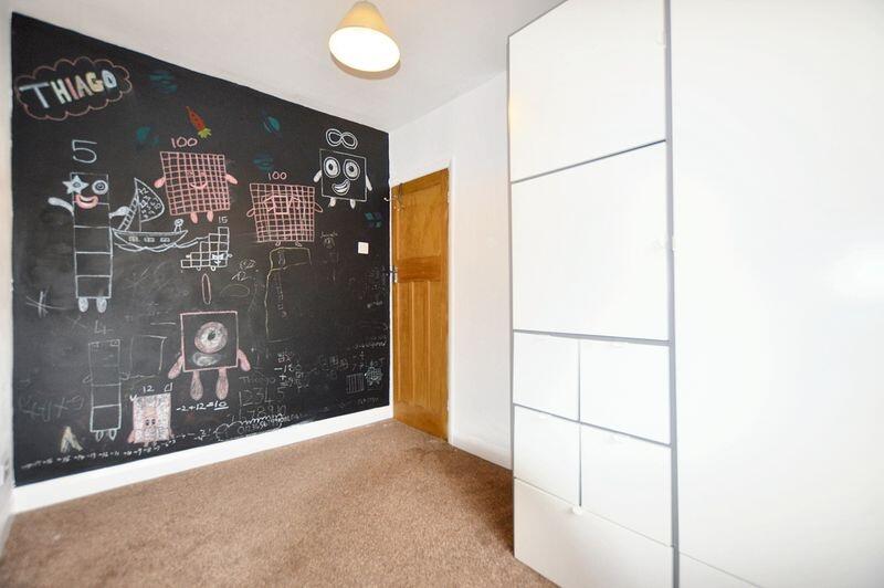 Bright single bedroom featuring a creative chal...