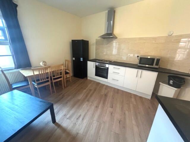 Bright and modern kitchen with ample natural li...