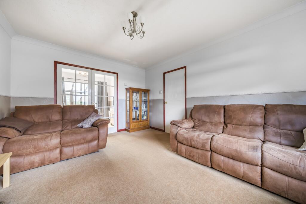 Living Room With Doors To Dining Room