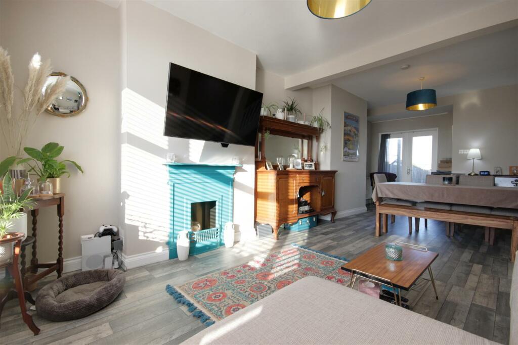 THROUGH LOUNGE AND DINING ROOM