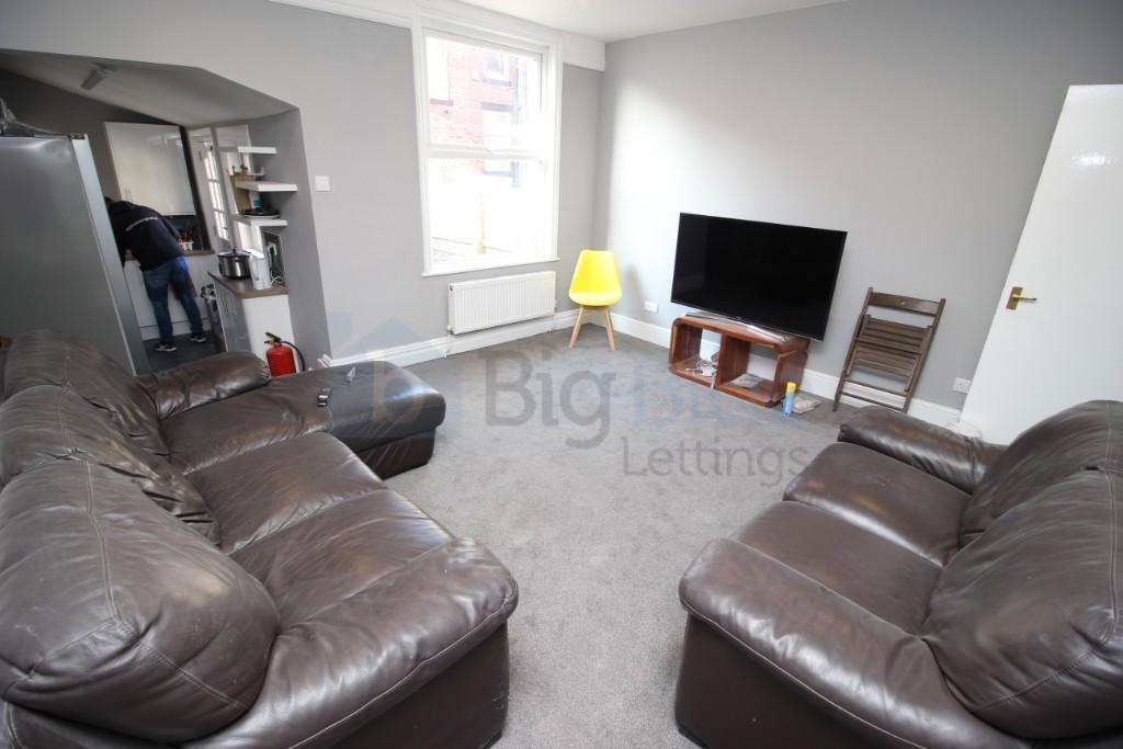A comfortable living room featuring two large l...
