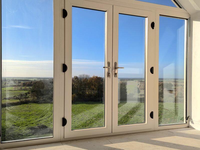 French doors with countryside views
