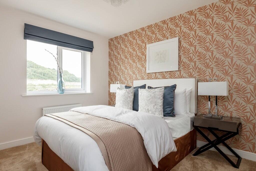 Bedroom 2 welcomes plenty of natural light