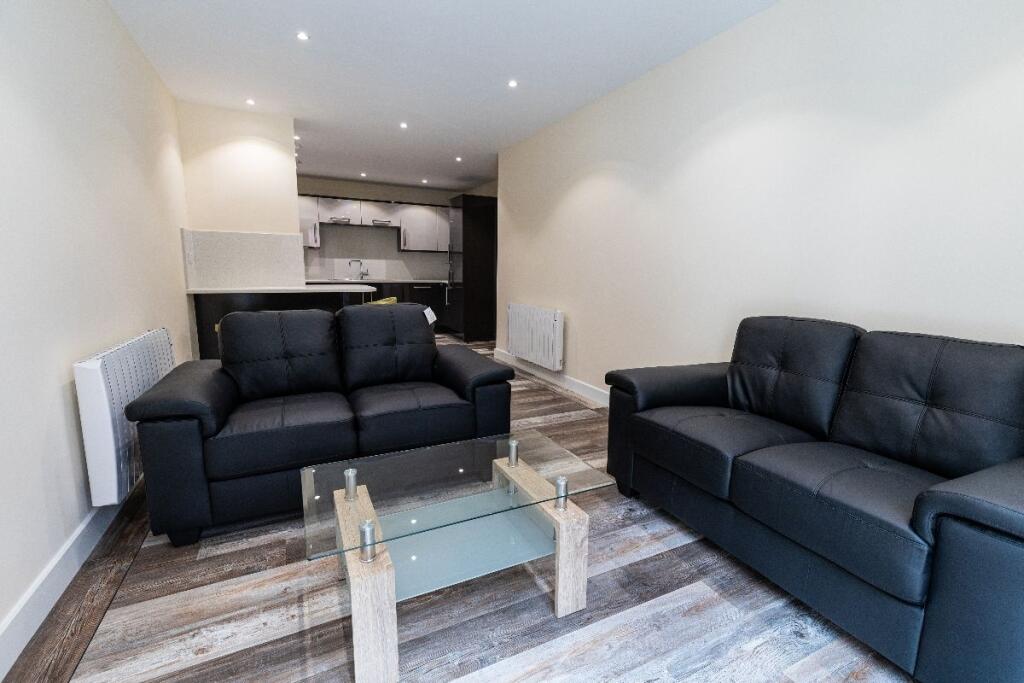 A modern living room featuring two comfortable ...