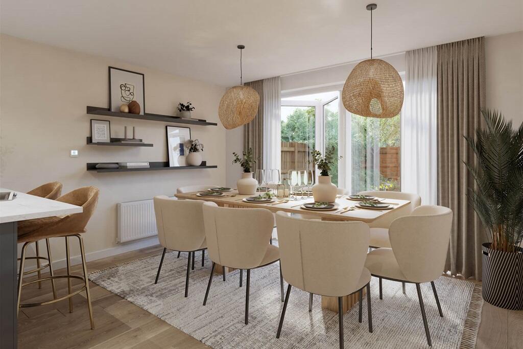 Bi-fold doors from kitchen/dining area - typical Taylor Wimpey home