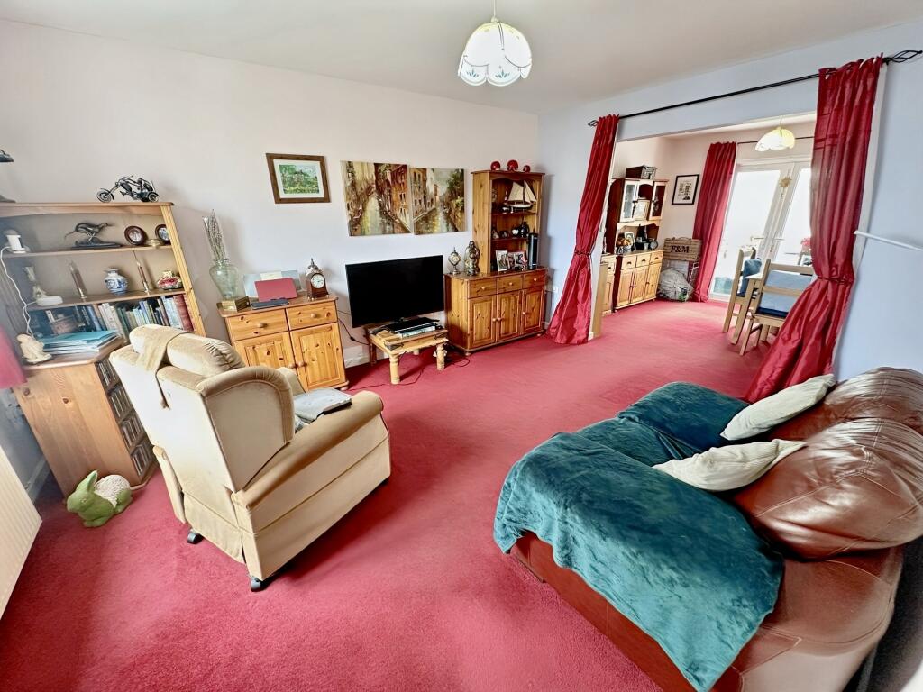 Living room with access to the dining area