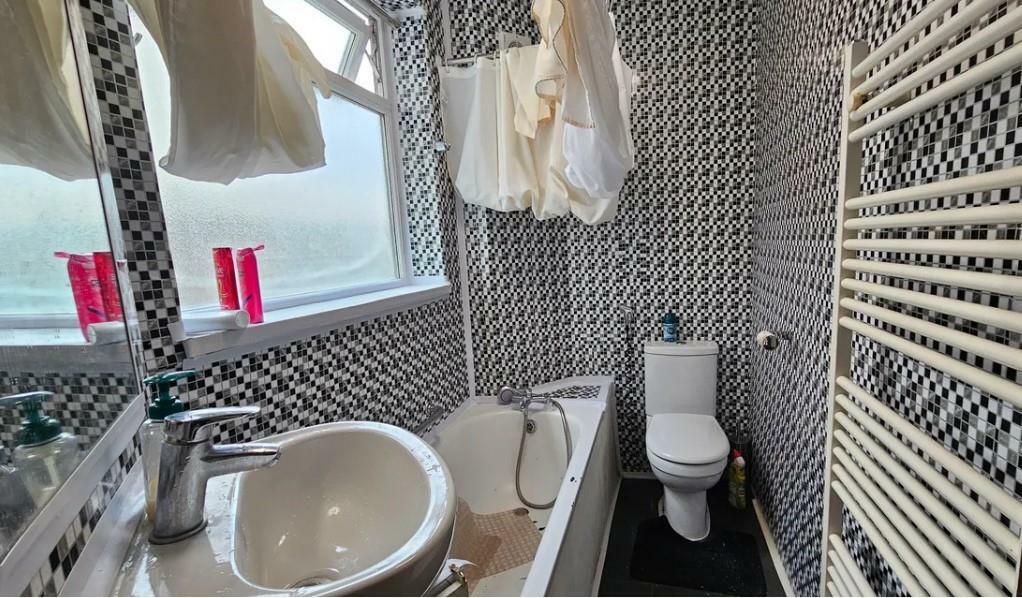 Fully tiled family bathroom