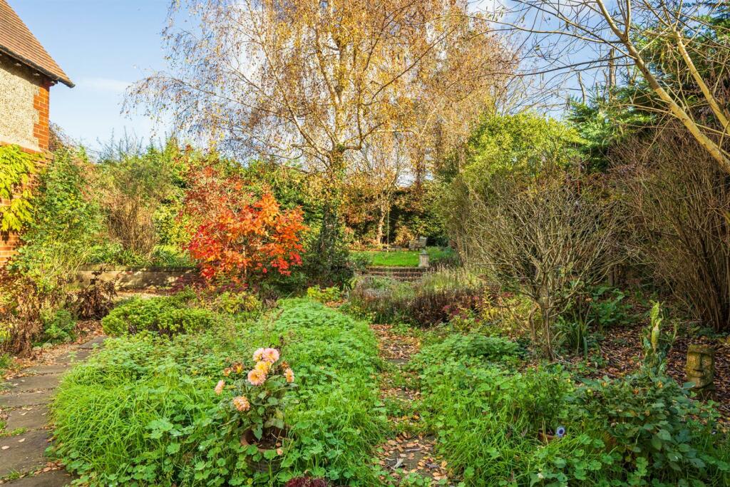 Flower beds and path to garden