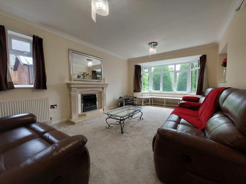 A cozy living room featuring comfortable leathe...