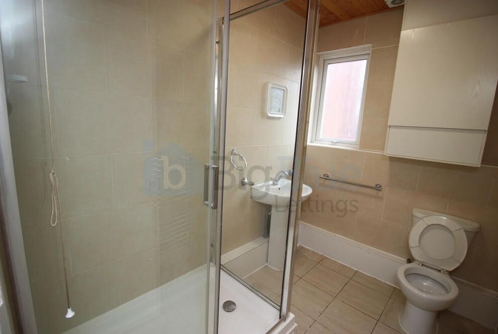 Bright and clean bathroom featuring a spacious ...