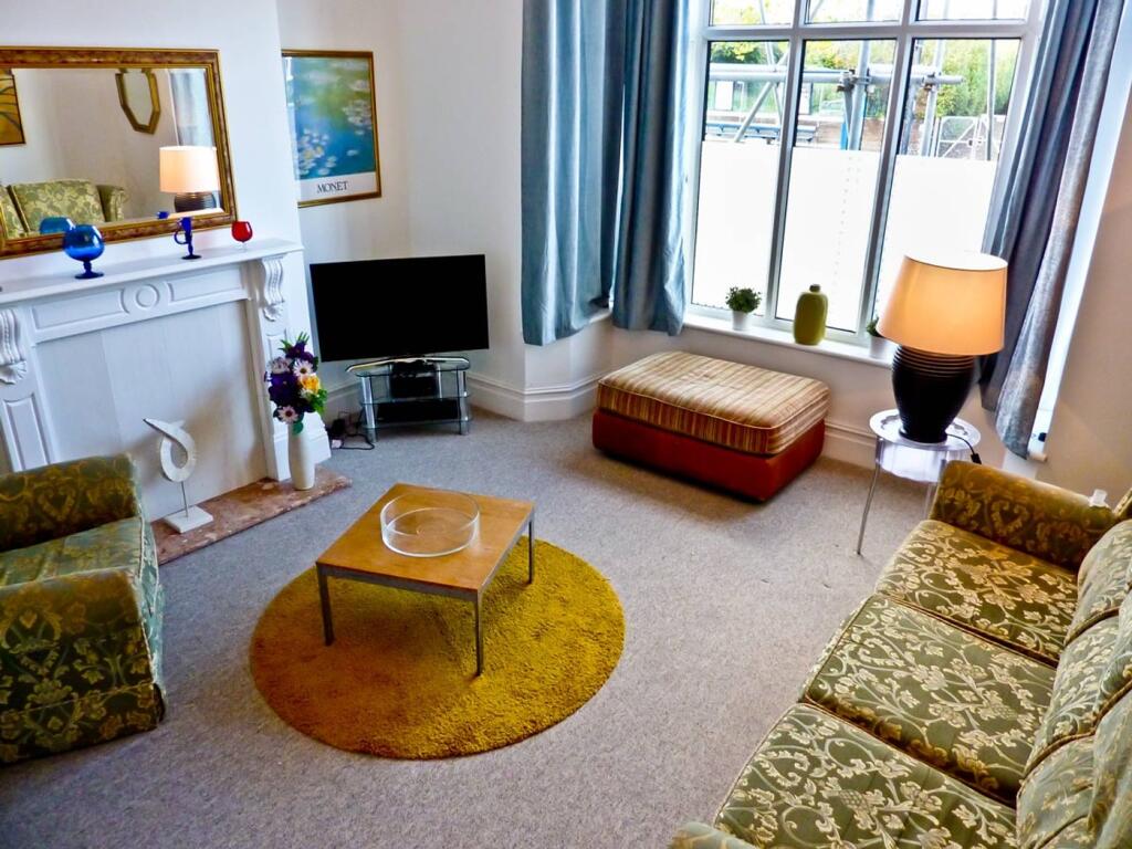 A cozy and inviting living room featuring styli...