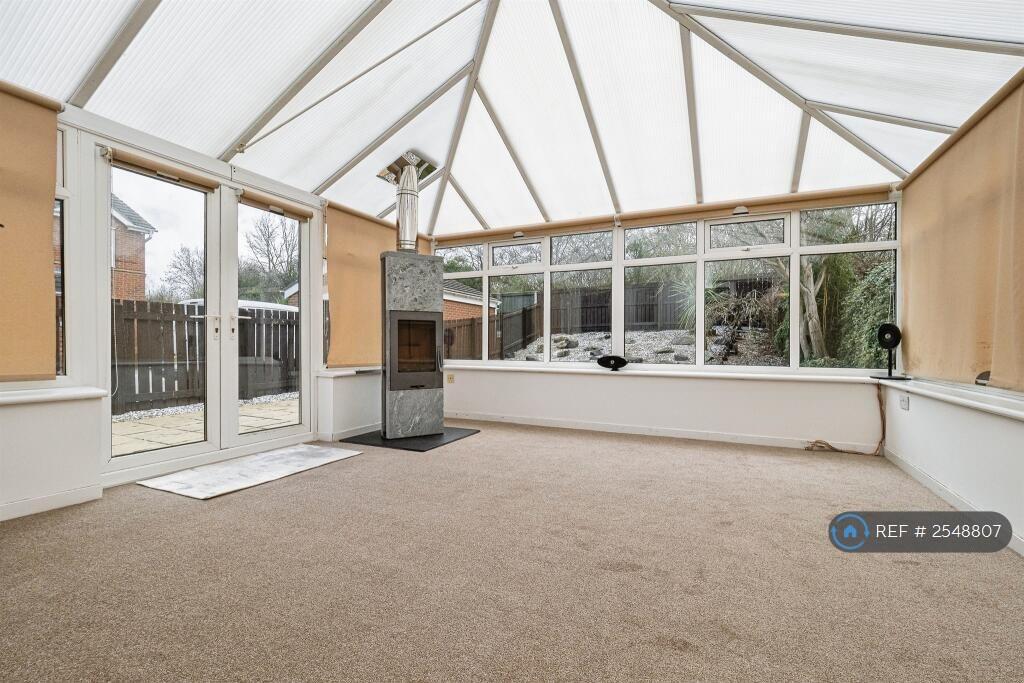 Conservatory With Log Burning Fireplace