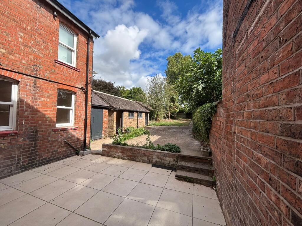Outdoor garden and patio area.