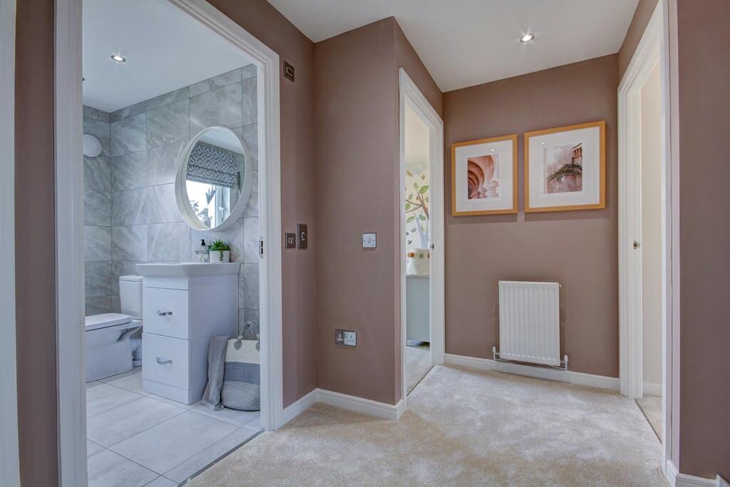 The bright landing leads into the 4 bedrooms and family bathroom