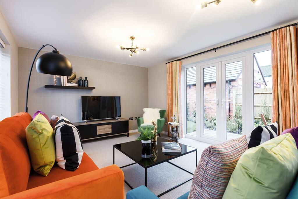 French doors opening out to the rear garden and patio