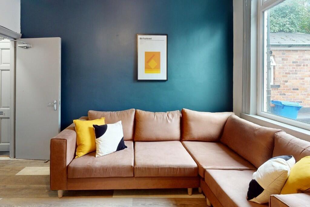 A modern living room featuring a stylish L-shap...