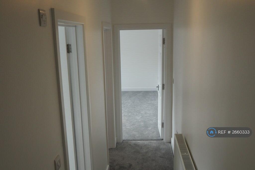 Hallway To The Utility Room And Bedroom 