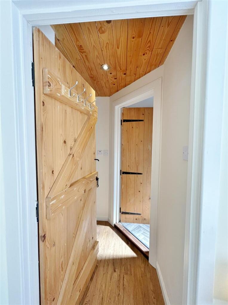 Into hall towards shower room