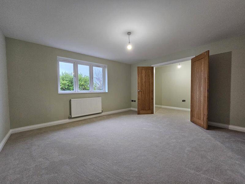 Bedroom One into Dressing Room