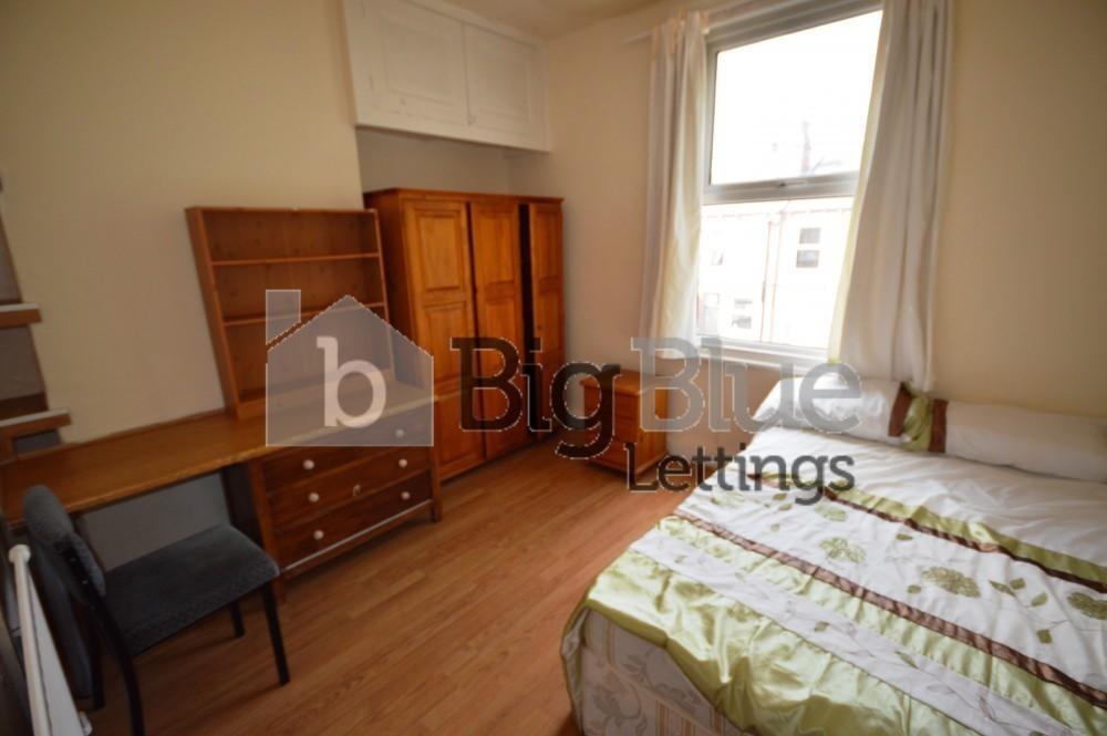 Bright and tidy double bedroom featuring a comf...