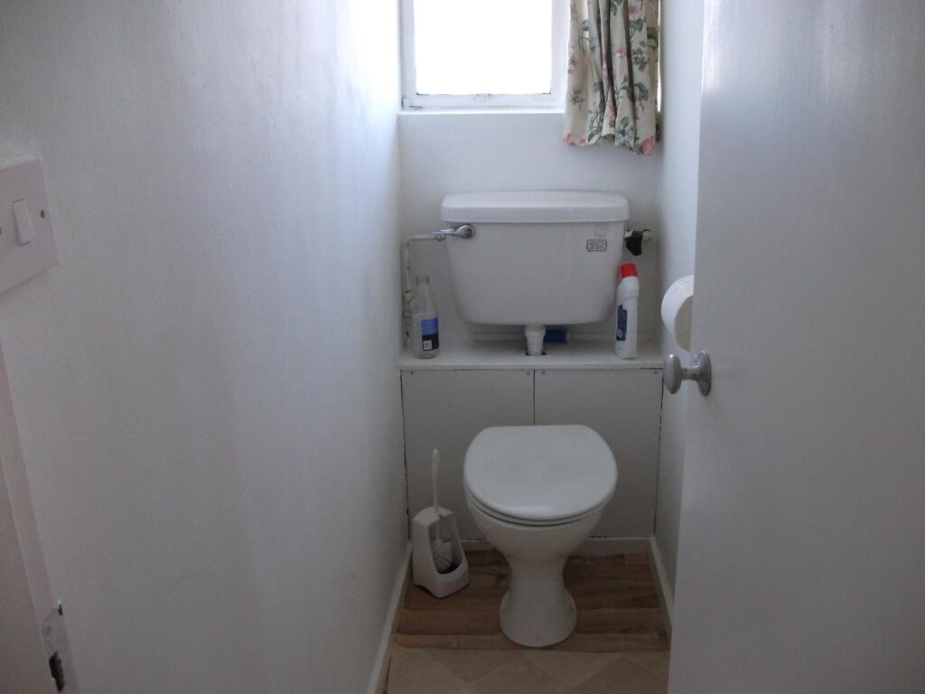 A functional single toilet with essential ameni...