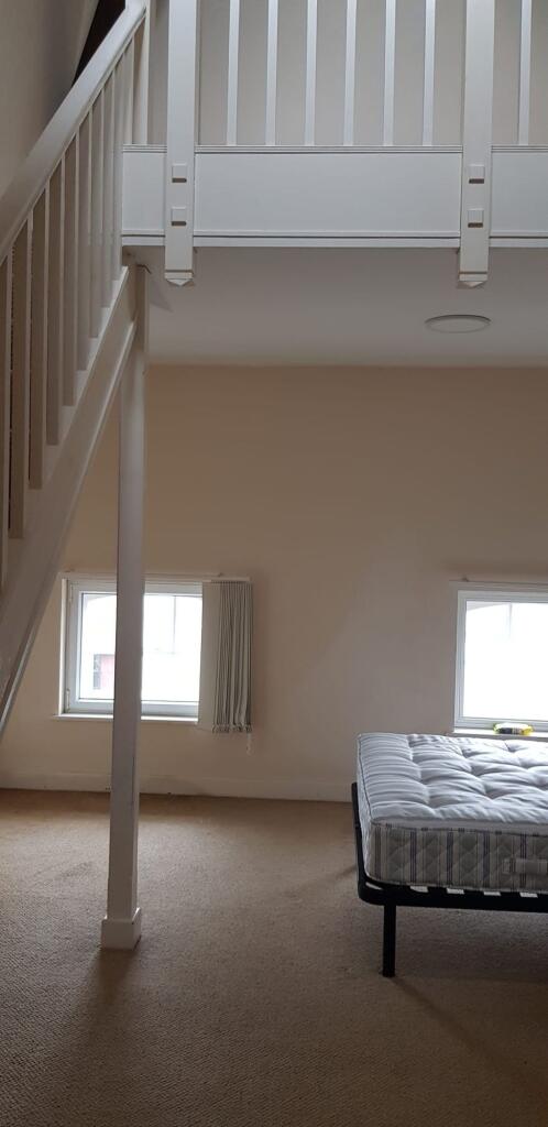 Bright and airy double bedroom featuring large ...