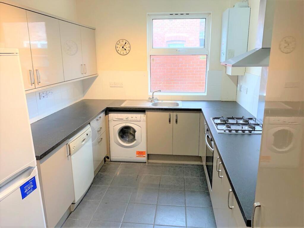 This well-appointed kitchen features modern app...