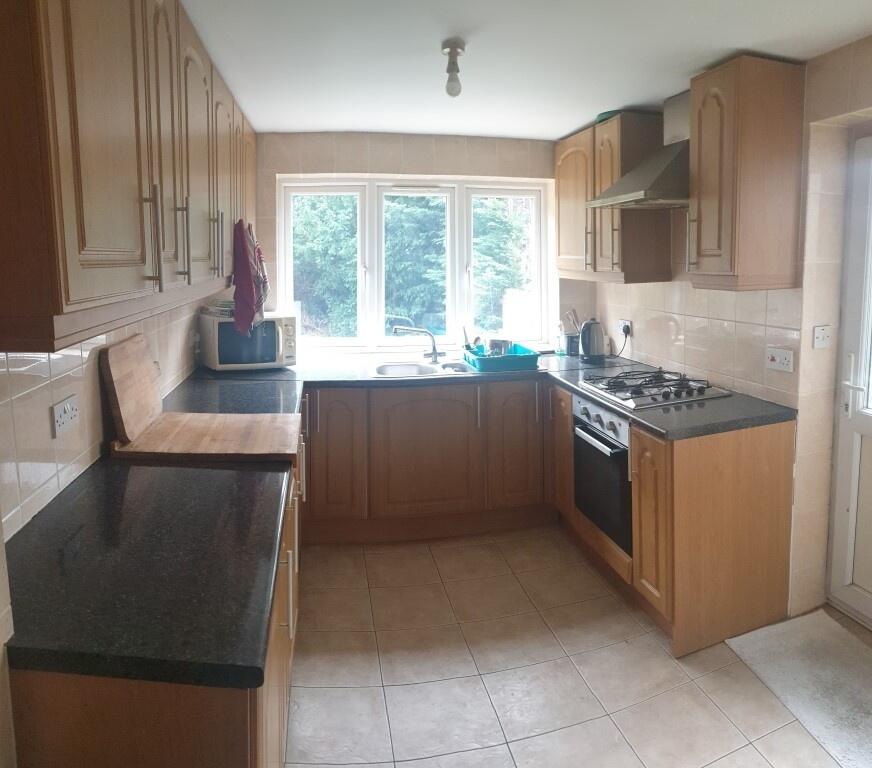 Bright and well-maintained kitchen featuring am...